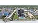 Aerial shot of a condominium building highlighting balcony and beach access in a residential neighborhood at 2121 Hill St # 7B, New Smyrna Beach, FL 32169