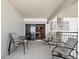 Spacious balcony with comfortable seating and a peek into the living area at 2121 Hill St # 7B, New Smyrna Beach, FL 32169
