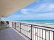 Balcony view of a sandy beach with a deep blue ocean and sky at 2121 Hill St # 7B, New Smyrna Beach, FL 32169