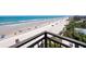Stunning beach view from a high vantage point with a visible horizon, beachgoers, and beach parking at 2121 Hill St # 7B, New Smyrna Beach, FL 32169