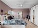 Bedroom features wood-style floors, a ceiling fan, and large closet at 2121 Hill St # 7B, New Smyrna Beach, FL 32169