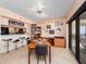 Dining space with ocean view, tiled floors, with a breakfast bar and dining table at 2121 Hill St # 7B, New Smyrna Beach, FL 32169