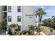 Landscaped condominium building near the beach, featuring decorative shrubbery at 2121 Hill St # 7B, New Smyrna Beach, FL 32169