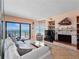 Cozy living room featuring a fireplace, ocean views, and comfortable seating at 2121 Hill St # 7B, New Smyrna Beach, FL 32169