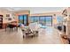 Open living space with tile flooring, ocean view, and a dining area at 2121 Hill St # 7B, New Smyrna Beach, FL 32169
