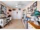 Bright office features a desk, couch, tile floors, and colorful decor at 2121 Hill St # 7B, New Smyrna Beach, FL 32169