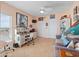 Office with white desk, gray couch, tiled floors, and various decor pieces at 2121 Hill St # 7B, New Smyrna Beach, FL 32169