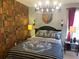 Cozy bedroom featuring Harry Potter themed decor and unique bookshelf wallpaper, plus a chandelier at 2121 Morocco Way, Kissimmee, FL 34747