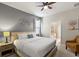 Comfortable bedroom with en-suite bathroom, soft lighting, and relaxing decor at 2121 Morocco Way, Kissimmee, FL 34747