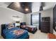 Charming themed ' bedroom with two twin beds, a Star Wars themed ceiling, and a TV at 2121 Morocco Way, Kissimmee, FL 34747