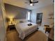Comfortable bedroom with en-suite bathroom, soft lighting, and relaxing decor at 2121 Morocco Way, Kissimmee, FL 34747