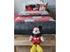 bedroom with Disney Mickey Mouse theme, colorful bedding, and playful accents at 2121 Morocco Way, Kissimmee, FL 34747