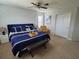 Inviting bedroom with blue accent wall, stylish decor, and comfortable bedding at 2121 Morocco Way, Kissimmee, FL 34747