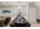 Elegant dining area featuring a modern chandelier and sophisticated table setting at 2121 Morocco Way, Kissimmee, FL 34747