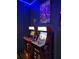 A game room with two arcade machines and superhero artwork for a nostalgic feel at 2121 Morocco Way, Kissimmee, FL 34747