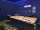A fun game room featuring a pool table, blue accent lighting, and a modern mini-split system at 2121 Morocco Way, Kissimmee, FL 34747