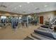 Well-equipped fitness center with treadmills, weights, and various exercise machines for residents' use at 2121 Morocco Way, Kissimmee, FL 34747