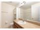Bathroom featuring a single sink vanity, cabinet, toilet and a shower at 2211 J Lawson Blvd, Orlando, FL 32824