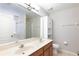 Bathroom featuring double sink vanity, tiled wall, and shower at 2211 J Lawson Blvd, Orlando, FL 32824