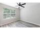 Bedroom featuring hardwood flooring, ceiling fan and natural light at 2211 J Lawson Blvd, Orlando, FL 32824