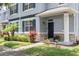 Inviting home entrance with well-maintained landscaping, stone accents and a covered front porch at 2211 J Lawson Blvd, Orlando, FL 32824