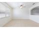 Bright living room with large window, fan, and tile flooring at 2211 J Lawson Blvd, Orlando, FL 32824