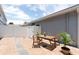 Private brick patio area with a wooden table and chairs at 2211 J Lawson Blvd, Orlando, FL 32824