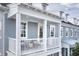 Charming balcony with white railings and supports, offering a cozy outdoor seating area at 2374 Celebration Blvd, Celebration, FL 34747