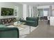 Open-concept living room with modern furnishings and seamless flow to dining area at 2374 Celebration Blvd, Celebration, FL 34747