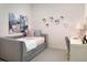 Stylish bedroom with a daybed, desk, and charming decor, perfect for relaxation and study at 2380 Celebration Blvd, Celebration, FL 34747