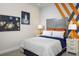 Comfortable bedroom featuring a space-themed decor, cozy bedding, and ample natural light at 2380 Celebration Blvd, Celebration, FL 34747