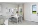 Cozy dining area featuring a white table, bench seating, and a view to the outdoors at 2380 Celebration Blvd, Celebration, FL 34747