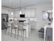 Modern kitchen with stainless steel appliances, granite countertops, and a breakfast bar at 2380 Celebration Blvd, Celebration, FL 34747