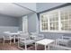 Covered patio featuring outdoor seating with white furniture and large window at 2380 Celebration Blvd, Celebration, FL 34747