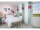 Cozy bedroom with two large windows and colorful floral accents at 2386 Celebration Blvd, Celebration, FL 34747