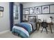 The bedroom features stylish decor, a comfortable bed, and ample natural light at 2386 Celebration Blvd, Celebration, FL 34747