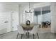 Bright dining room with contemporary chandelier and view of the lanai at 2386 Celebration Blvd, Celebration, FL 34747