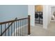 Hallway view of stainless steel washer and dryer behind cabinet doors on the second floor landing with carpeted floor at 2386 Celebration Blvd, Celebration, FL 34747
