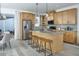 Modern kitchen featuring an island with seating and stainless steel appliances at 2386 Celebration Blvd, Celebration, FL 34747