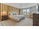 Bright bedroom featuring white bed linens, a large window, and modern decor at 2438 Dubai St, Kissimmee, FL 34747