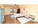 Spacious bedroom featuring wood floors, a ceiling fan, and large window with natural light at 26 Canter Club Ct, Debary, FL 32713