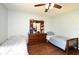 Spacious bedroom with hardwood floors, dresser and two beds at 26 Canter Club Ct, Debary, FL 32713