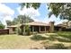 A one story brick home with screened porch offering outdoor living and a spacious yard at 26 Canter Club Ct, Debary, FL 32713
