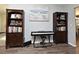 Cozy piano room featuring built-in bookshelves and elegant decor at 26 Canter Club Ct, Debary, FL 32713