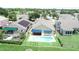 Birds-eye view of landscaped backyard with pool, patio, and neighboring homes at 2622 Clarinet Dr, Orlando, FL 32837