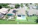Aerial view of houses, showcasing backyard with pool, lawn and well maintained landscape at 2622 Clarinet Dr, Orlando, FL 32837