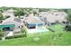 Aerial view of backyard with a pool, deck and lawn area in a suburban neighborhood at 2622 Clarinet Dr, Orlando, FL 32837
