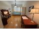 Versatile bedroom with wood floors, daybed, desk, and seating area providing flexibility at 2622 Clarinet Dr, Orlando, FL 32837
