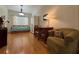Versatile bedroom with wood floors, daybed, desk, and seating for work or rest at 2622 Clarinet Dr, Orlando, FL 32837