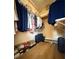 Walk-in closet with wood floor and shelving providing ample storage for an organized space at 2622 Clarinet Dr, Orlando, FL 32837